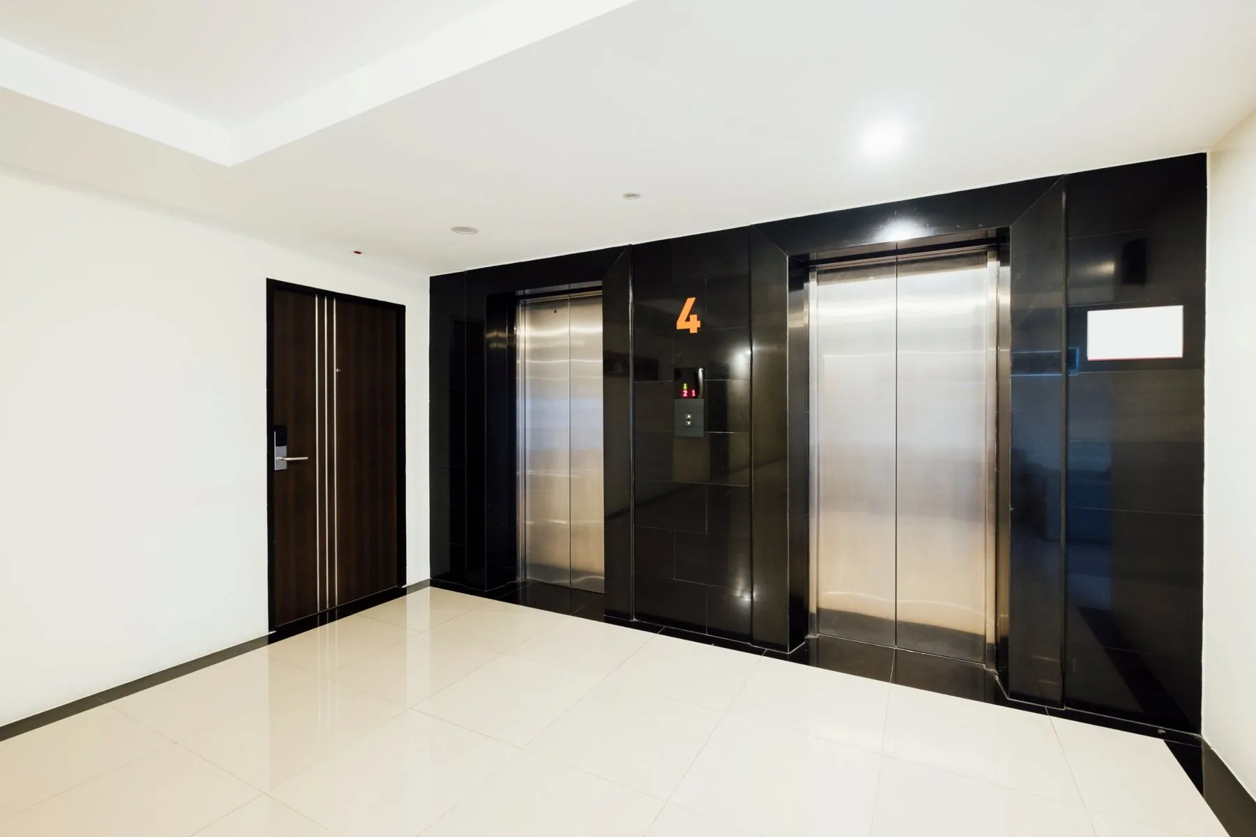 Apartment building lift lobby with two lifts