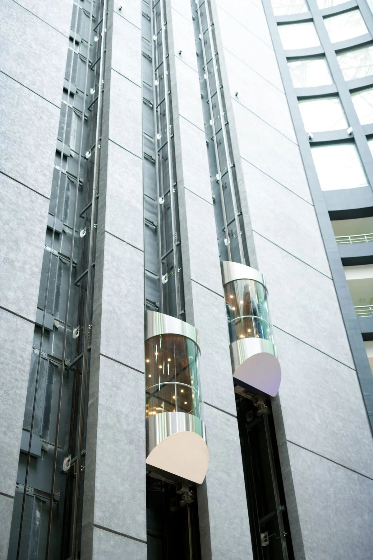 Panoramic glass lifts installed in a multi-storey Melbourne atrium