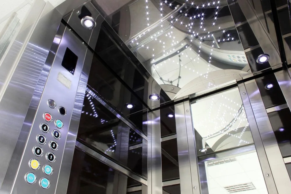 Modernised stainless steel lift car with new control panel